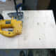 Marking out and cutting the shelf made from a sheet of pine.