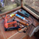Tools used to fit beading in place and make good; no nails adhesive, staple gun, hammer if required, sander, and silicone for bead between glass and wood to finish.