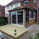 Patio doors of conservatory leading onto decking.