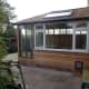 Guttering installed under eaves, with downpipe leading to house water drain.