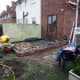 Foundation wall built, damp proof membrane laid over hard-core.