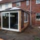 Conservatory clad in cedar wood.