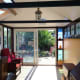 View of conservatory looking out onto the back garden, after completion.