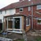 Laying red cedar tiles on the west facing roof