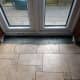 Gap filled with concrete to an inch below floor level; to allow for tiling.