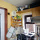 The original location of light switch (to the left of the wall clock) for the outside light.
