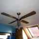The original ceiling fan light with a single 60 watt bulb.