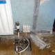 Lifting the floorboards to gain access to the cables.