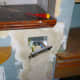 Wall re-plastered over cable channel to make good and new double socket wired.