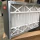 This is an example of a media filter. Filter replacements aren't as cheap as your standard 1" filter and installation will likely require some modification to your return duct.