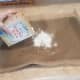 Pour your entire box of baking soda out onto your pan.