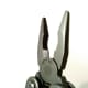 Close-up of the pliers showcasing the spring and wire cutters.