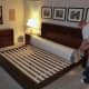 The mattress is tightly rolled and compressed inside two layers of plastic.