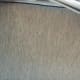 The side of the mattress is 12 inches tall and is outfitted in a chic gray material.