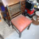 One of the four chairs waiting to be renovated.