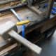 Using a chisel and mallet to clear out the old mortise joint.