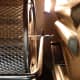The right end of the rotisserie basket that attaches to the rotisserie mechanism. It will drop straight down into the slot.