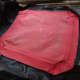 Using the original cover as a template to cut out the replacement covers from the recycled faux leather.