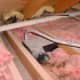 Bathroom vent missing discharge pipe in the attic - should be always discharging to the exterior