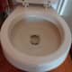 After an hour of the Borax and lemon juice soaking in the toilet bowl,  flush the toilet NOTE: this toilet has enamel that has worn off so that is not still dirt or stains in the toilet bowl