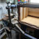 Using a wooden mallet to gently separate the joints so as to remove the stretcher.