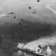 The USS North Carolina under attack from Japanese warplanes.