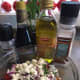Pour blended olive oil and vinegar over tomatoes, mix gently, refrigerate for about an hour and enjoy!