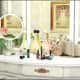 Your female Sim definitely needs this dainty set: makeup, perfume, and a vanity mirror.
