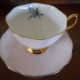 This Royal Albert cup has it's design inside the cup; plain pink outside.