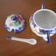 It comes with a little porcelain spoon.