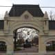The original entrance to the stockyards, recognized as a historical landmark, which in real life is located in an industrial park. You can see the memorial through the gate.
