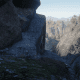 The fork in the path you come to. Lower slope, on the right, leads to a Rock Carving. The upper slope on the left is what you want to follow to get the treasure.