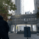 The Crowley Building courtyard. Notice how Ubisoft added in a bunch of brush (and there's like a car dealership behind where Aiden's facing). In real life it's just a very wide expanse of cement. Nothing wrong with that though!