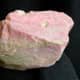 This pink rock was found on a hillside among tailings from a mine.