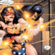 A blind-folded Wonder Woman deflecting a barrage of bullets with her magical bracelets.