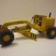 1964 Tonka mini-grader. Tonka also released 'mini' toys in the early 2000s, but those are truly minis&mdash;around 3&ndash;4 inches long. The 1964 version is almost a foot long.