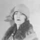 A cloche hat is pulled down over this model's head in this photo from 1926.