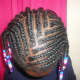 I go from side to side when braiding the top of her hair.