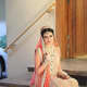 Pakistani bridal wear in peach tones.