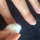 Use cotton balls to apply nail polish remover.