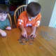 My boys sorting and stacking their coins.