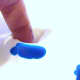 Finger mixing a primary color.
