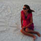 An arrow in the sand points to baby #3.