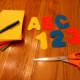 Cut out letters and numbers with scissors.