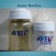 Two Avent bottles of different sizes. One is tinted, as many Avent bottles are.