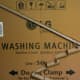 Use tacky glue to arrange cardboard tubes on a large box. This is on the side of a cardboard "clubhouse" made from a washing machine box.