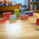 Recycle old boxes to create a pretend town for children.