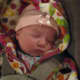 Bundle up your newborn if you're taking him or her outside on a chilly day!