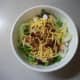 Add shredded cheddar cheese and sprinkle on a few bacon bits.