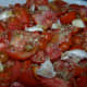 Step one: Mix tomatoes, garlic, seasoning, oregano, basil and olive oil together.